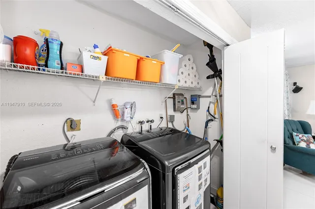 a utility room with dryer and washer