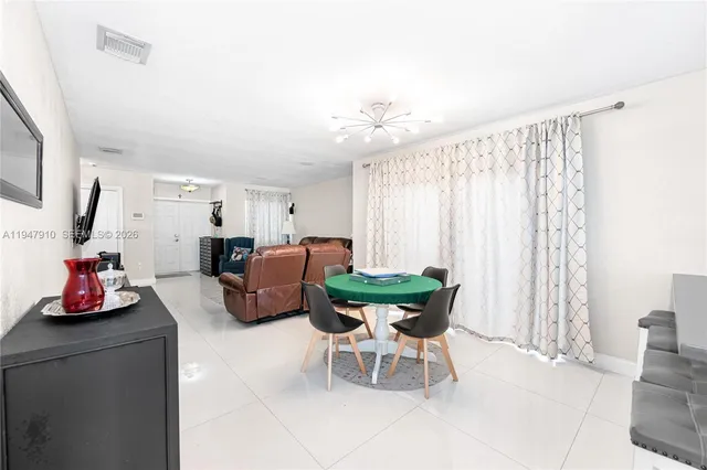 a room with furniture and a large window