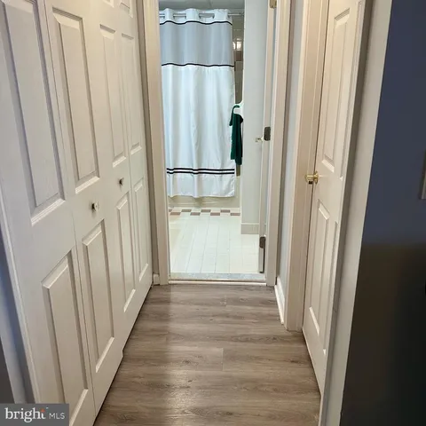 a bathroom with a toilet and a shower curtain