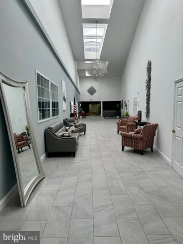 a view of a room with shelves and wooden floor