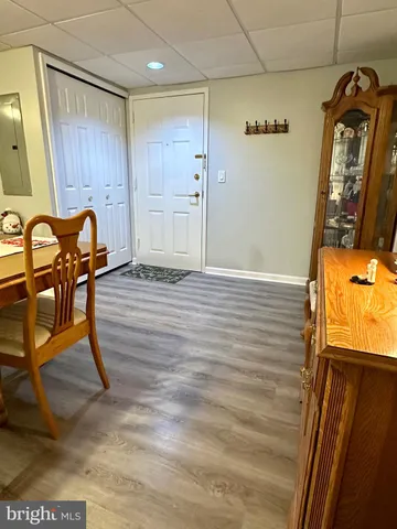 a living room with furniture fireplace and flat screen tv