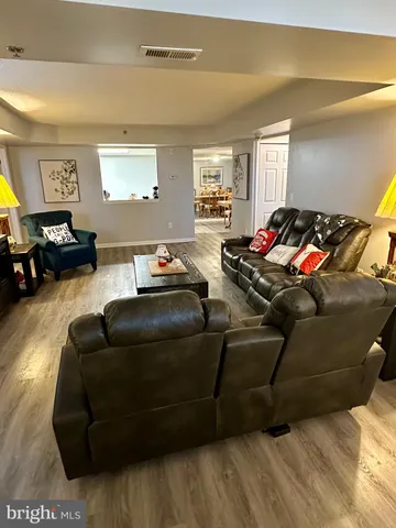 a kitchen with granite countertop a refrigerator and a stove top oven