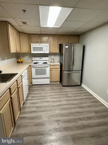a view of a living room and hardwood floor