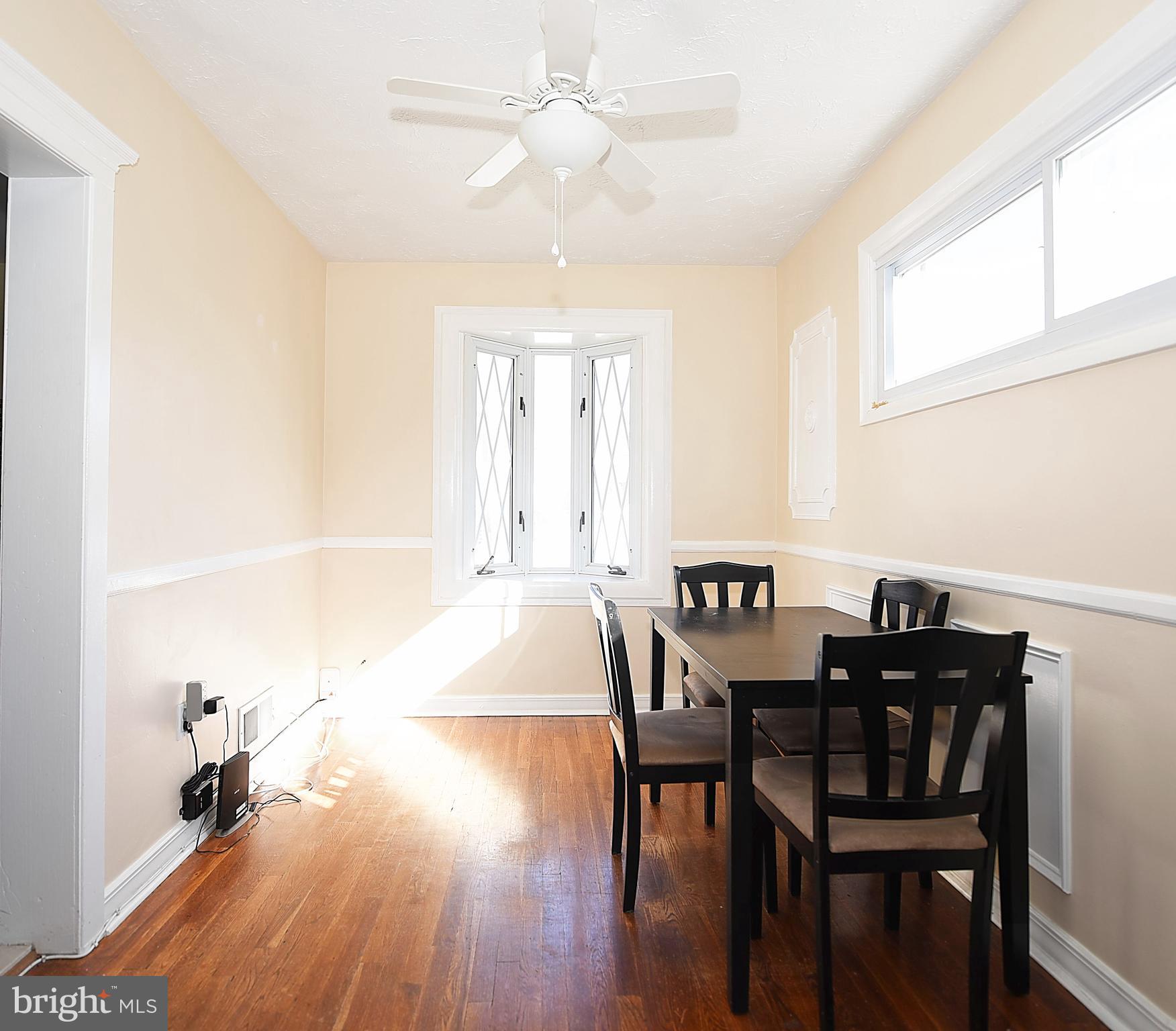 4423 Fenor Road Baltimore, MD 21227 - Photo 9 of 28 a view of a dining room with furniture and wooden floor