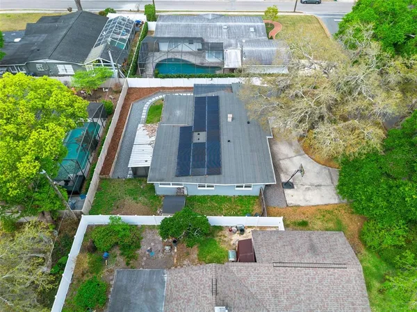 an aerial view of a house with a garden and plants