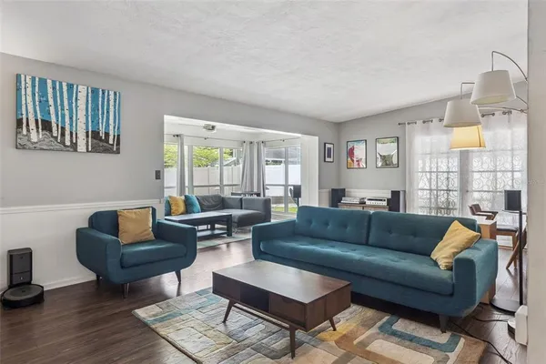 a living room with furniture and a large window