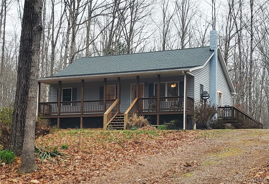 443 Lazy Acres Road Bumpass, VA 23024 - Photo 17 of 19 a front view of a house with a yard and garage
