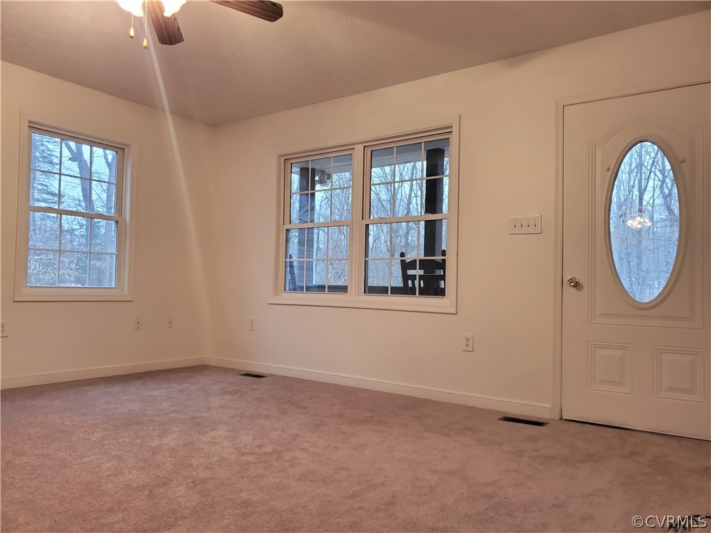 443 Lazy Acres Road Bumpass, VA 23024 - Photo 3 of 19 an empty room with windows
