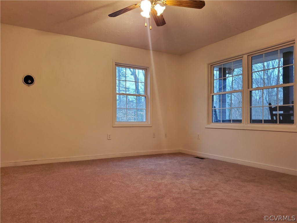 443 Lazy Acres Road Bumpass, VA 23024 - Photo 4 of 19 a view of an empty room with a window