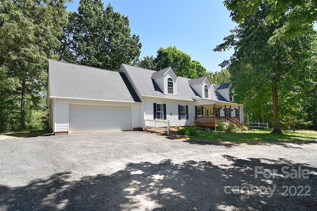 130 Printhad Road Dallas, NC 28034 - Photo 1 of 43 a view of a house with a yard and large trees