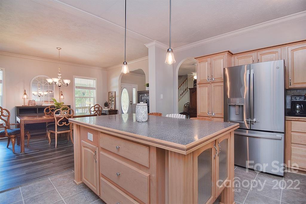 130 Printhad Road Dallas, NC 28034 - Photo 15 of 43 a kitchen with kitchen island a counter top space appliances and a center island