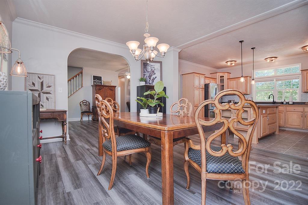 130 Printhad Road Dallas, NC 28034 - Photo 17 of 43 a view of a dining room with furniture and wooden floor
