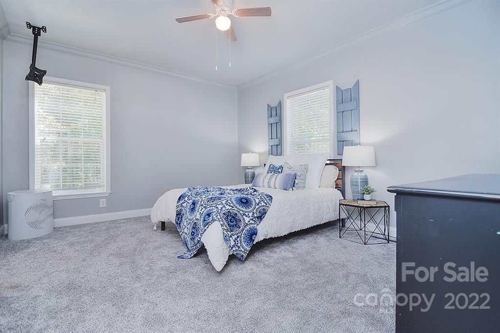 130 Printhad Road Dallas, NC 28034 - Photo 20 of 43 a bedroom with a bed and a window