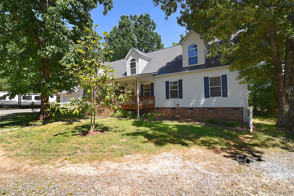 130 Printhad Road Dallas, NC 28034 - Photo 2 of 43 a view of a house with a yard