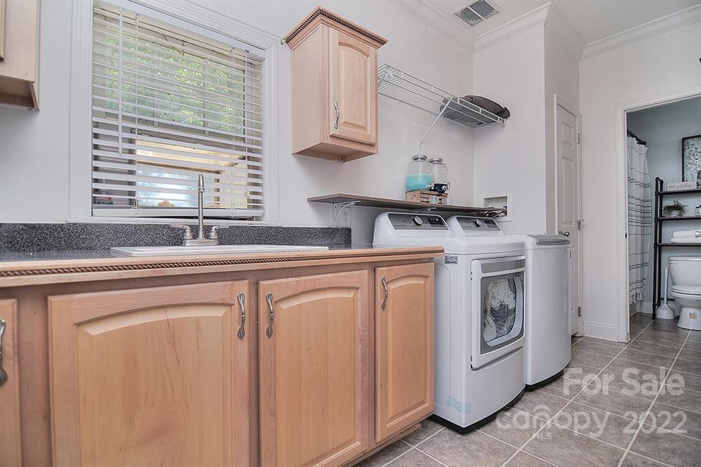 130 Printhad Road Dallas, NC 28034 - Photo 24 of 43 a kitchen with stainless steel appliances granite countertop white cabinets and a sink