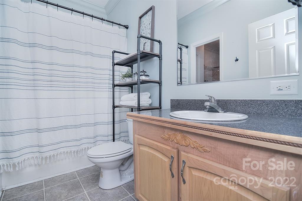 130 Printhad Road Dallas, NC 28034 - Photo 26 of 43 a bathroom with a sink toilet and shower