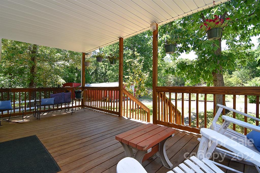 130 Printhad Road Dallas, NC 28034 - Photo 3 of 43 a view of a chairs on wooden deck