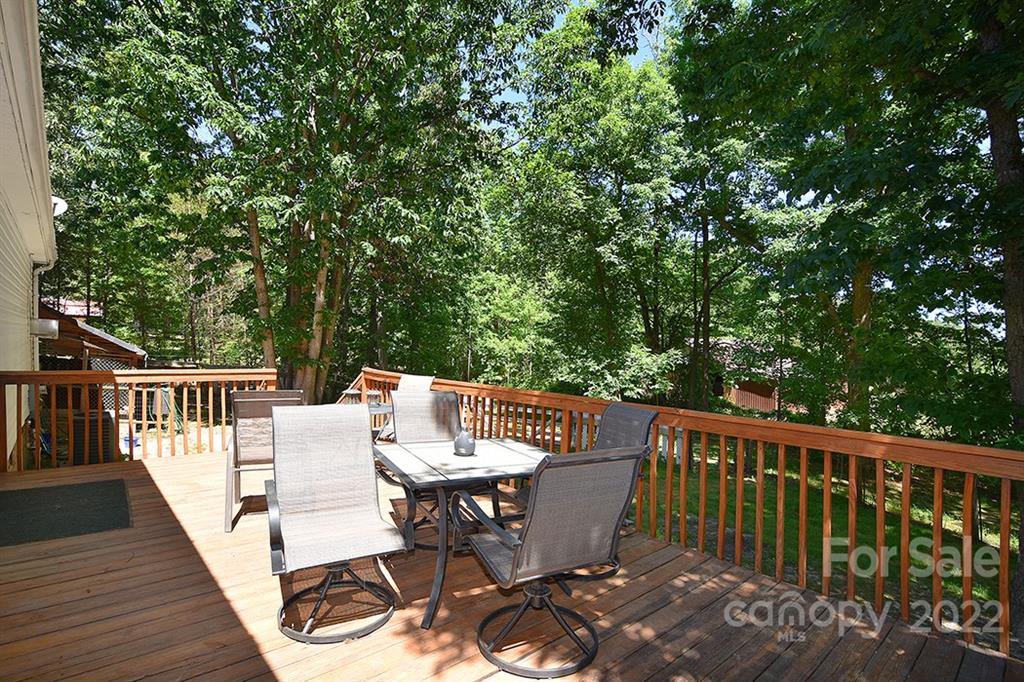 130 Printhad Road Dallas, NC 28034 - Photo 32 of 43 a view of a dinning table and chairs on the roof deck