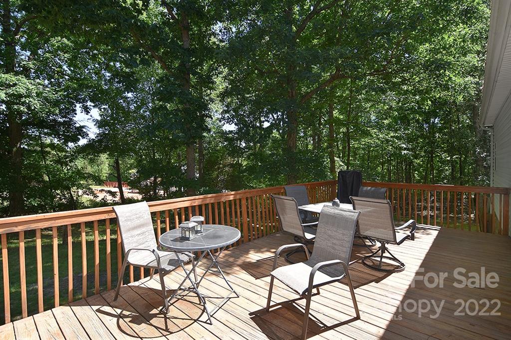 130 Printhad Road Dallas, NC 28034 - Photo 33 of 43 a view of a chairs and table in the deck