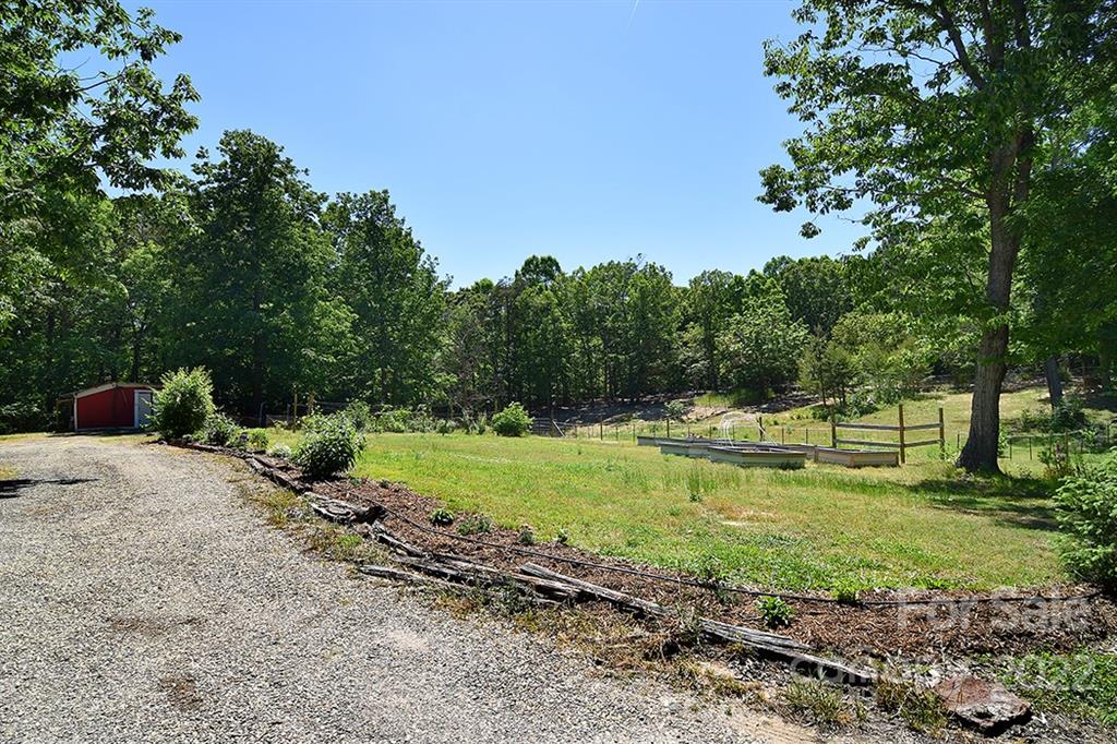130 Printhad Road Dallas, NC 28034 - Photo 40 of 43 a view of a backyard with large trees
