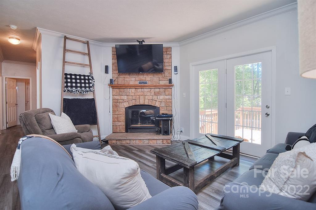 130 Printhad Road Dallas, NC 28034 - Photo 8 of 43 a living room with furniture and a fireplace