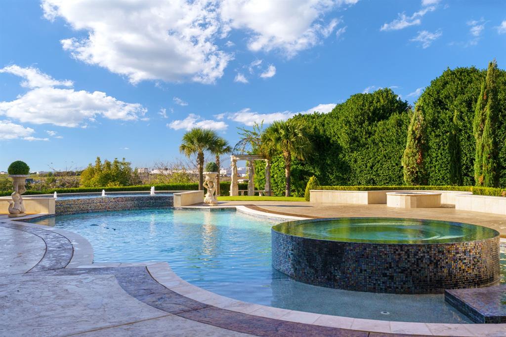 6509 Sudbury Road Plano, TX 75024 - Photo 15 of 23 View of pool featuring a pool with connected hot tub and a patio area