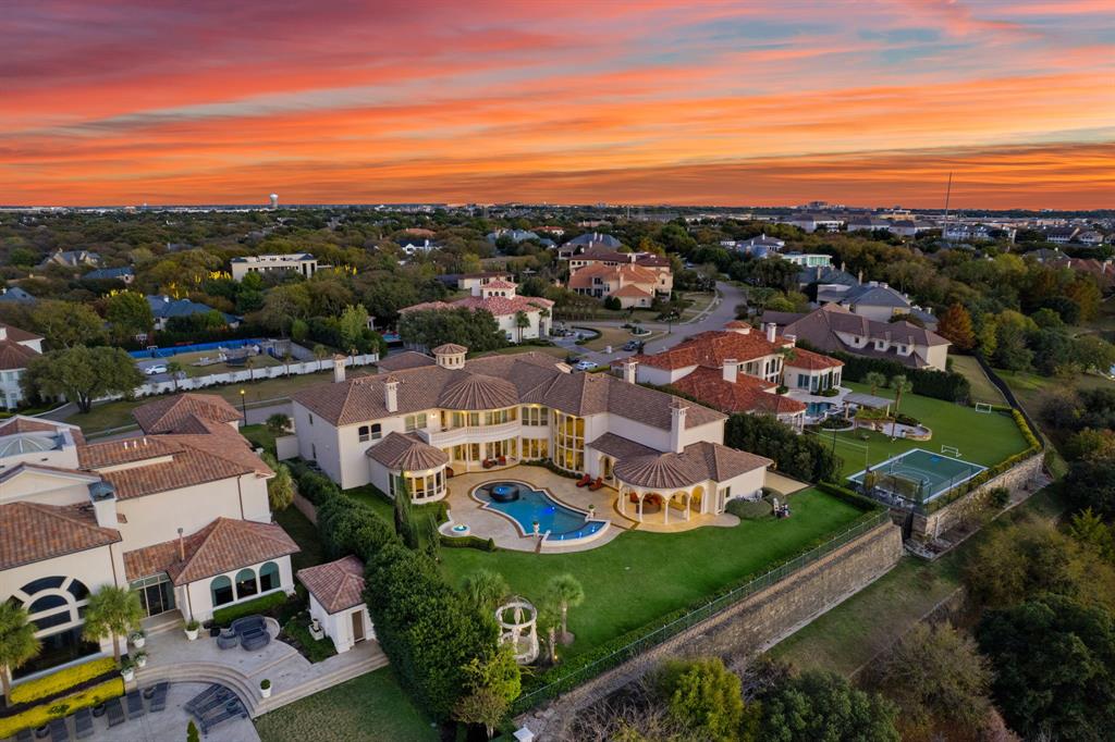 6509 Sudbury Road Plano, TX 75024 - Photo 22 of 23 Aerial view at dusk of view of pool area and a residential view