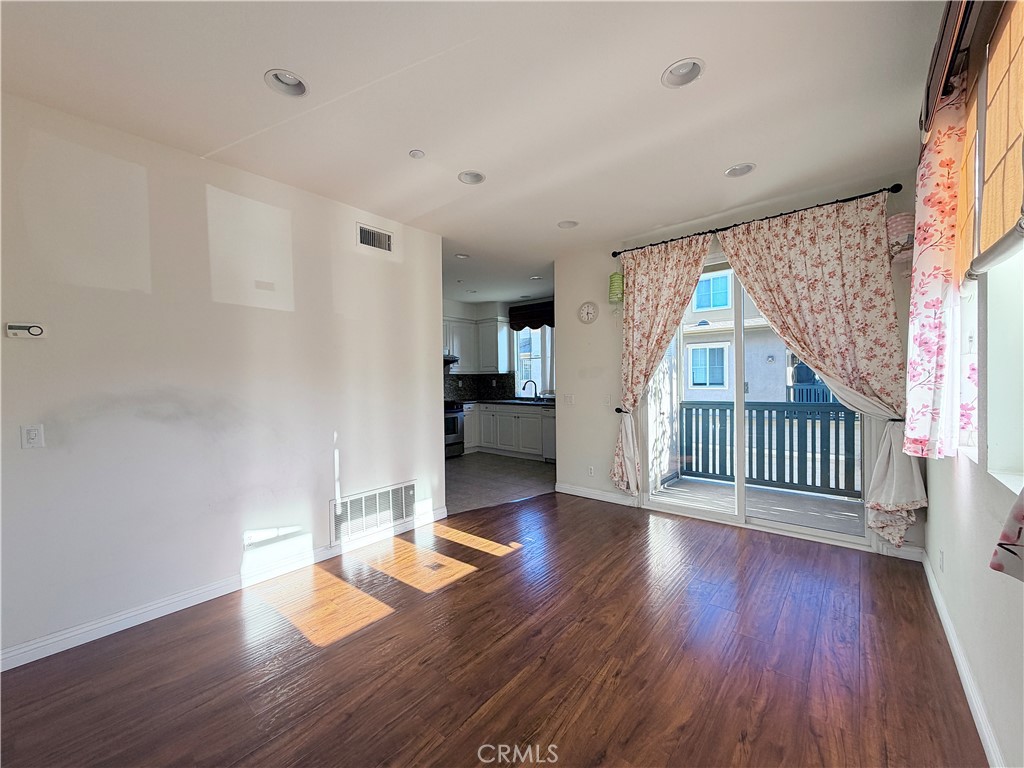 111 Liberty Street Tustin, CA 92782 - Photo 4 of 8 wooden floor in an empty room with a window