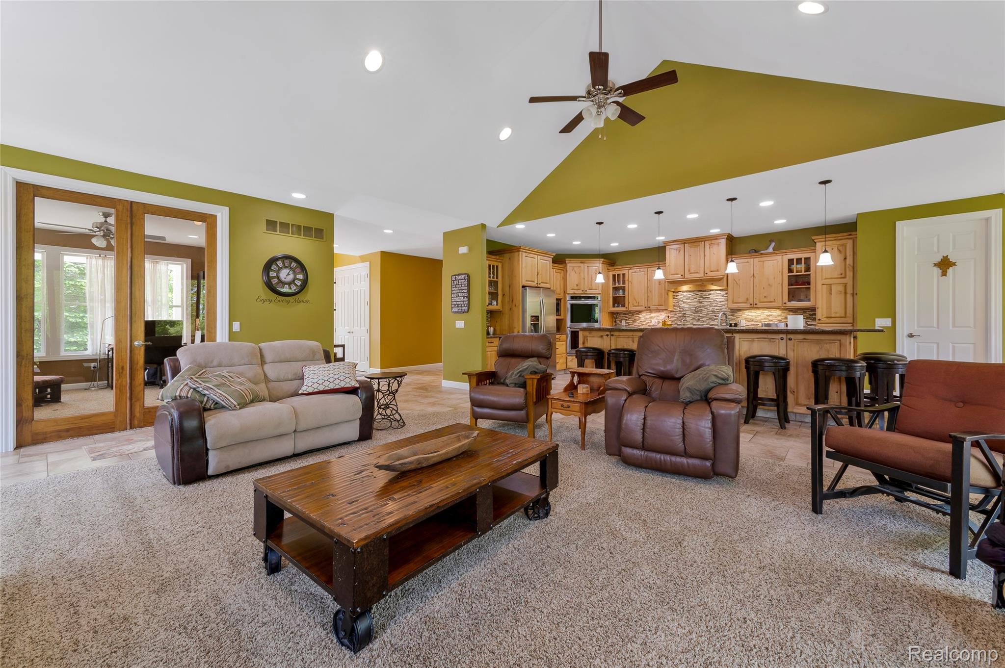 13085 Rohn Road Fenton, MI 48430 - Photo 12 of 52 Living area featuring a ceiling fan, light colored carpet, recessed lighting, and vaulted ceiling