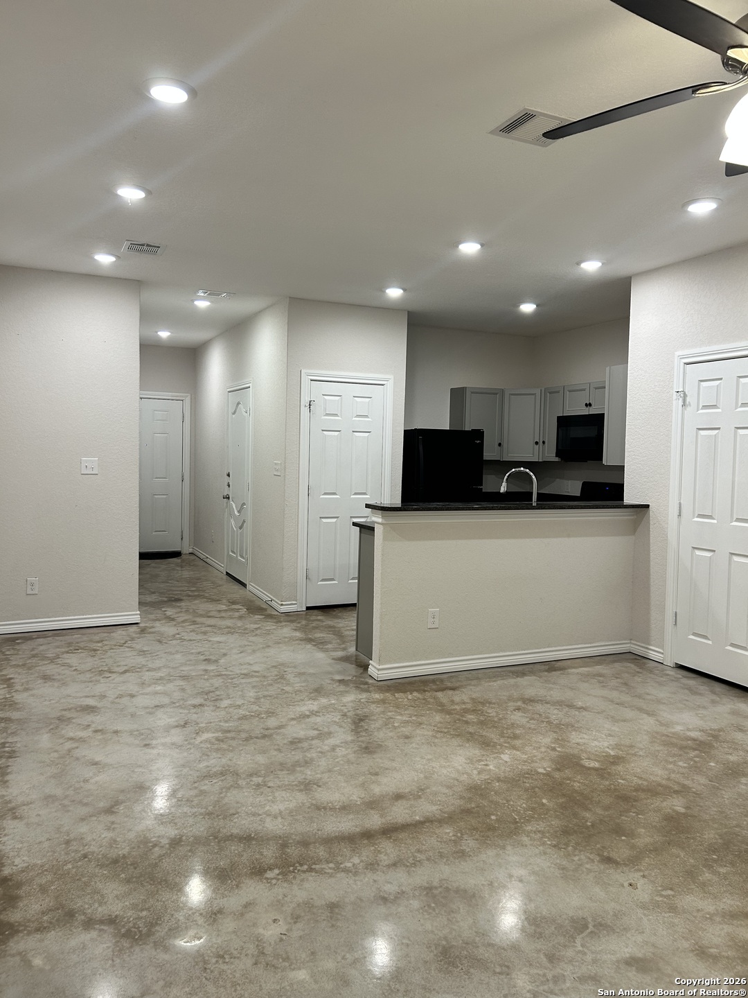 6926 Crestway Road, Unit 3 San Antonio, TX 78239 - Photo 3 of 13 a view of kitchen with kitchen island a sink stainless steel appliances and cabinets