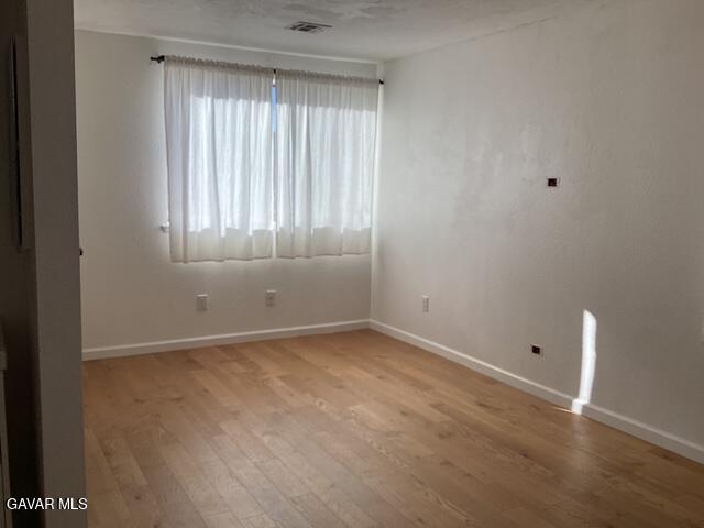 44532 15th Street East, Unit 7 Lancaster, CA 93535 - Photo 11 of 13 a view of an empty room with a window