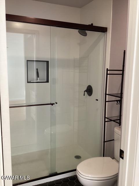 44532 15th Street East, Unit 7 Lancaster, CA 93535 - Photo 12 of 13 a bathroom with a toilet and a shower