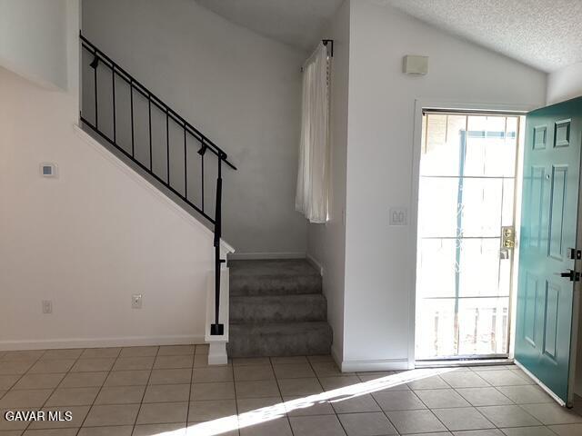 44532 15th Street East, Unit 7 Lancaster, CA 93535 - Photo 2 of 13 a view of entryway with stairs and wooden floor