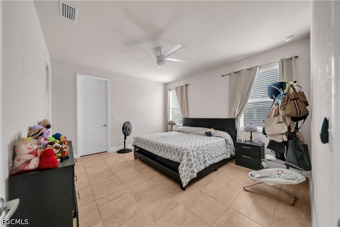 384 Neighborly Road LaBelle, FL 33935 - Photo 28 of 45 a bedroom with a bed and a window