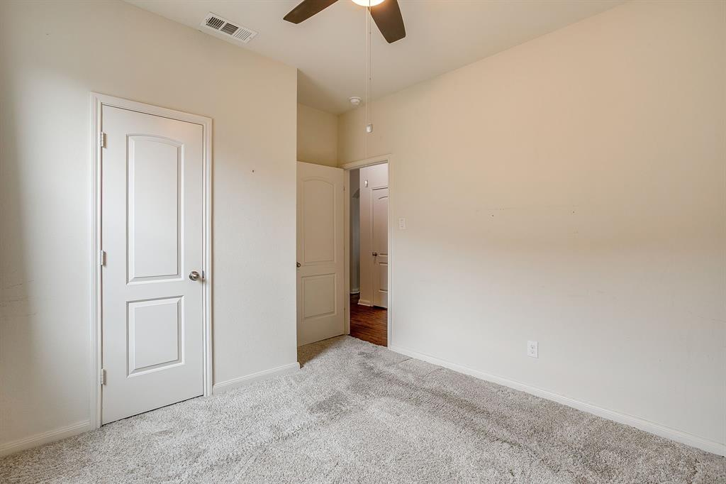 136 Kennedy Drive Venus, TX 76084 - Photo 17 of 27 an empty room with closet and windows