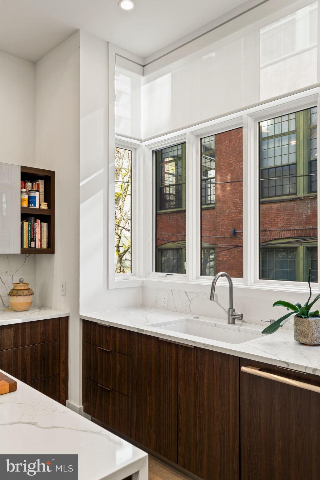 1646 Carlton Street Philadelphia, PA 19103 - Photo 23 of 66 a kitchen with a sink and large window