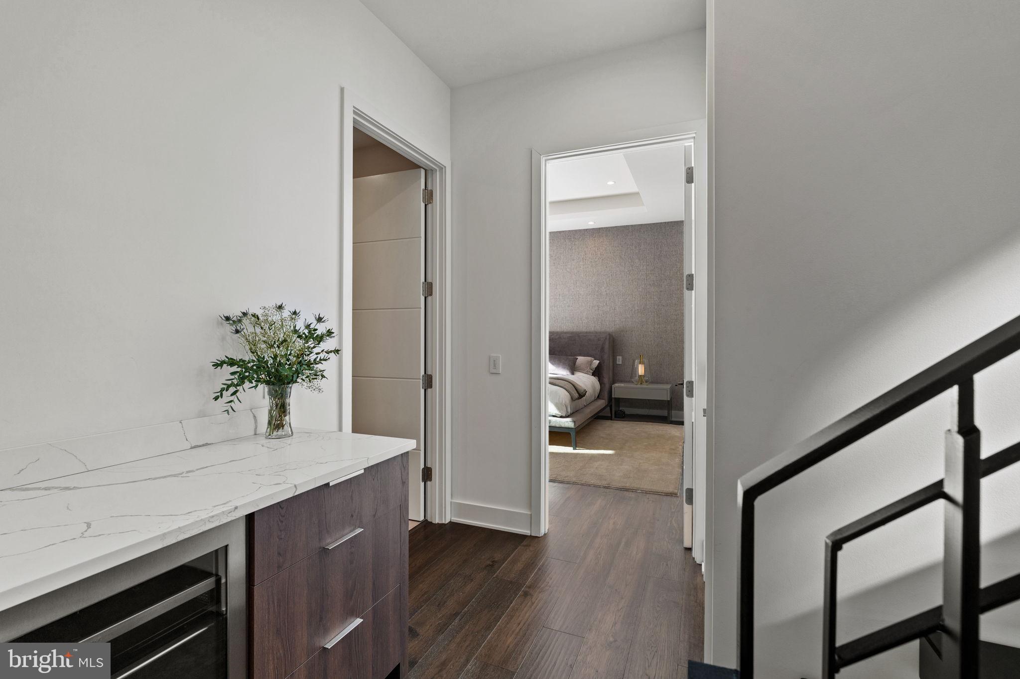 1646 Carlton Street Philadelphia, PA 19103 - Photo 33 of 66 a hallway with a wooden floor and furniture