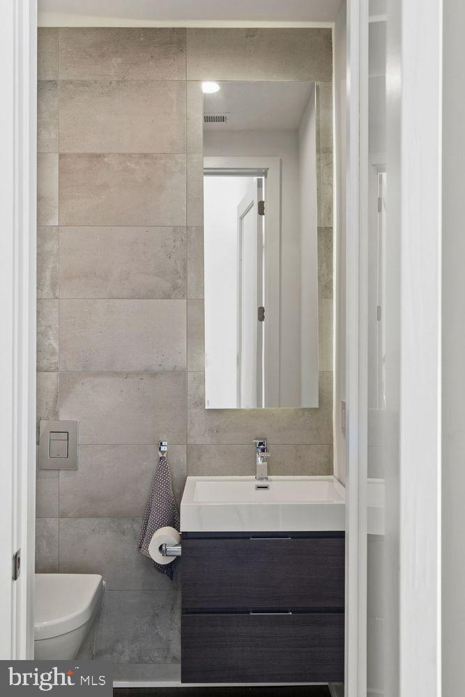 1646 Carlton Street Philadelphia, PA 19103 - Photo 41 of 66 a bathroom with a sink and a mirror