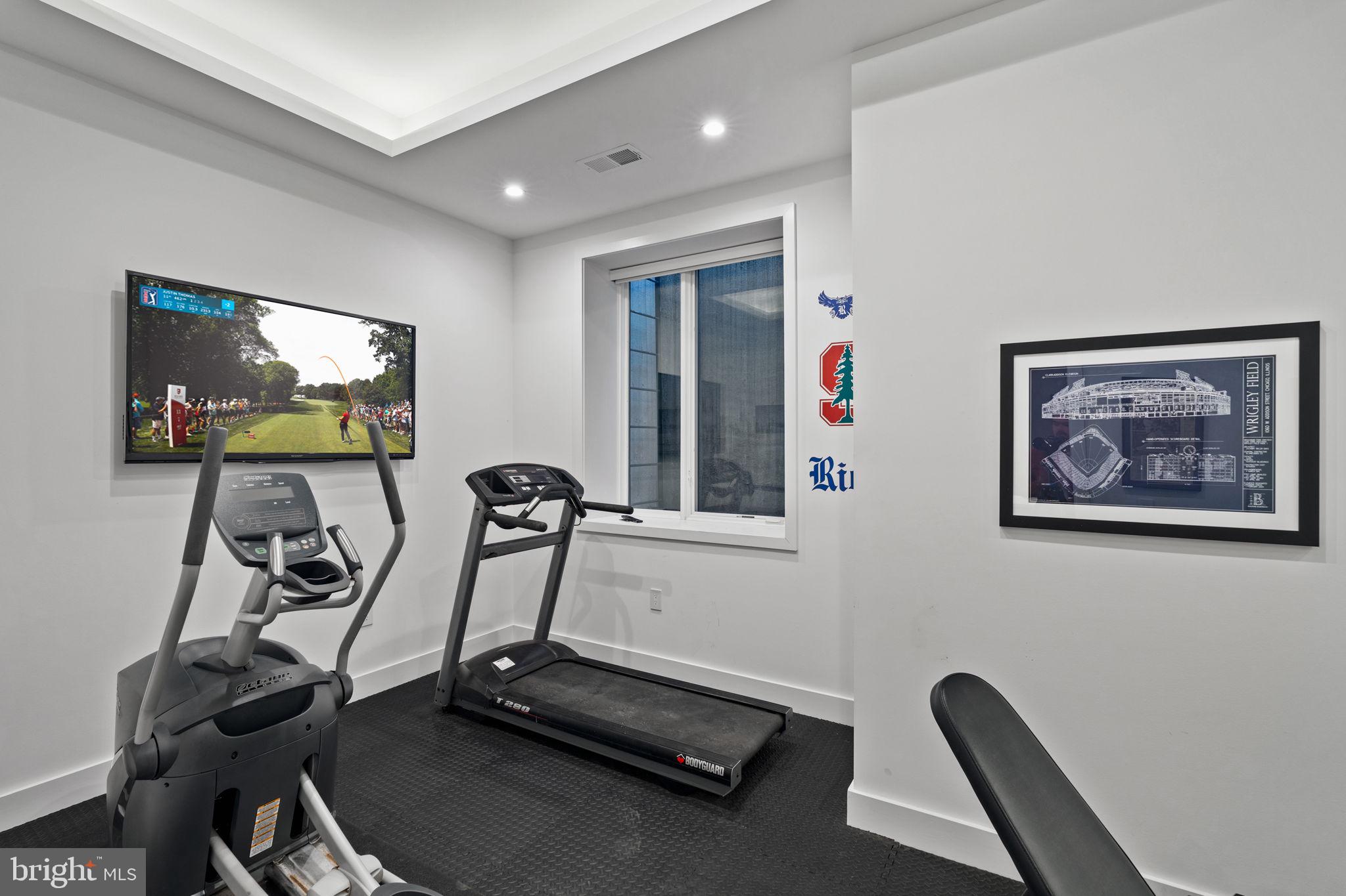 1646 Carlton Street Philadelphia, PA 19103 - Photo 55 of 66 a room with gym equipment and windows