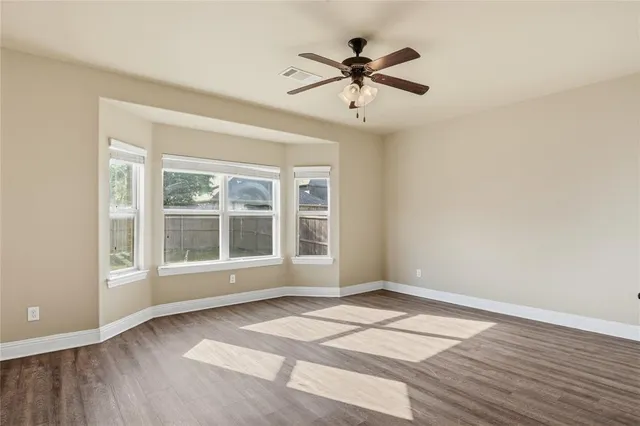 a bathroom with a tub sink shower and mirror