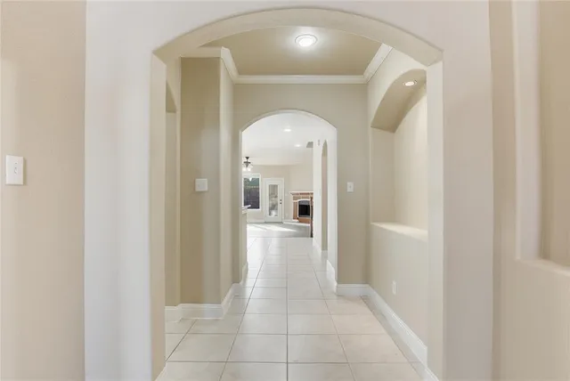 a view of a hallway view with wooden floor and staircase