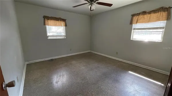 an empty room with windows