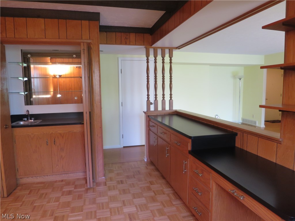 3701 Mayfield Road, Unit 118 Cleveland, OH 44121 - Photo 10 of 26 Convenient built-in cabinets and shelves plus wet bar in den/library.