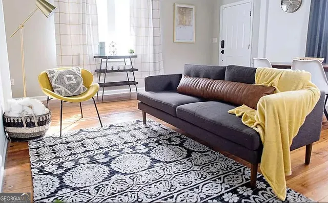 a living room with furniture and a window