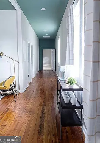 a bathroom with a toilet a sink and a mirror