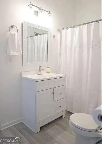 a bedroom with bed and a window