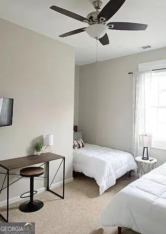 a bathroom with a granite countertop sink and mirror