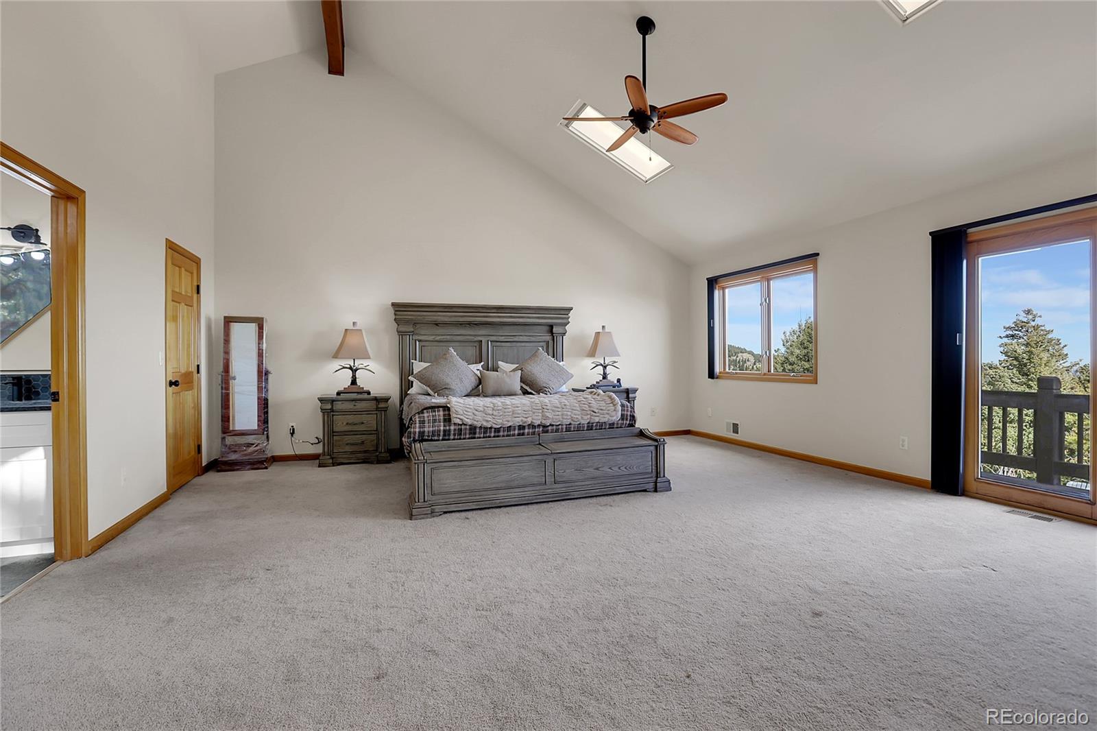 12954 South Ridge Road Conifer, CO 80433 - Photo 8 of 24 a living room with furniture and a chandelier
