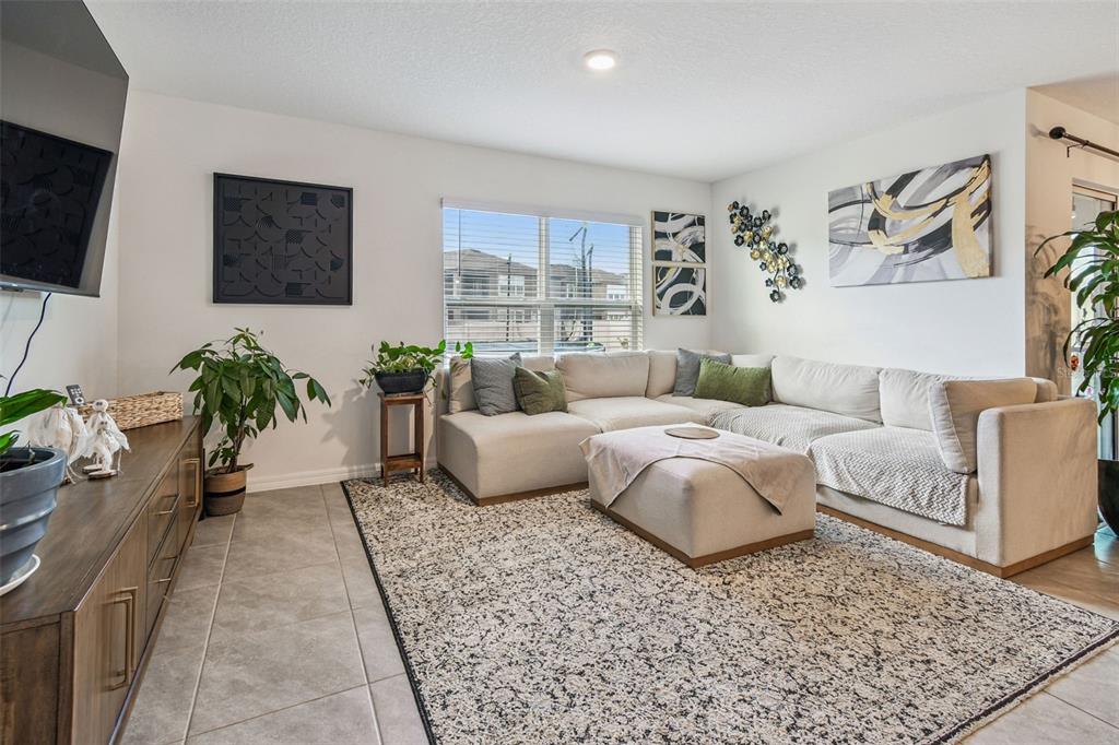 3139 Silver Date Drive Wimauma, FL 33598 - Photo 12 of 47 a living room with furniture and a flat screen tv