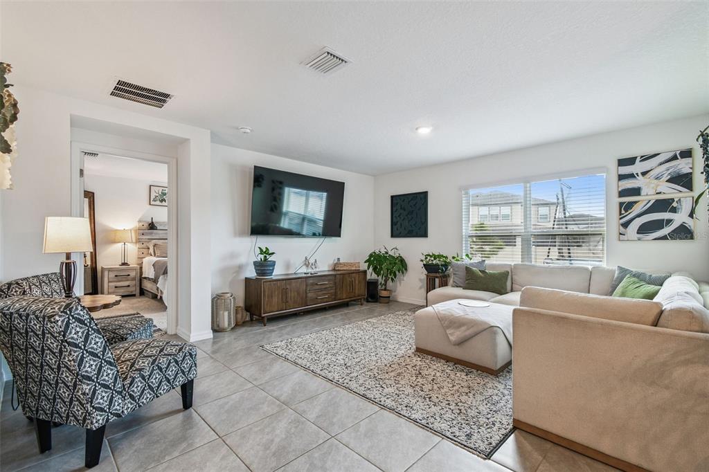 3139 Silver Date Drive Wimauma, FL 33598 - Photo 13 of 47 a living room with furniture and a flat screen tv